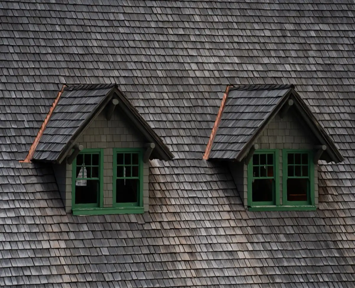 Dormers on a shingle roof in Aloha, OR, where step flashing and kickout flashing carry water past the walls