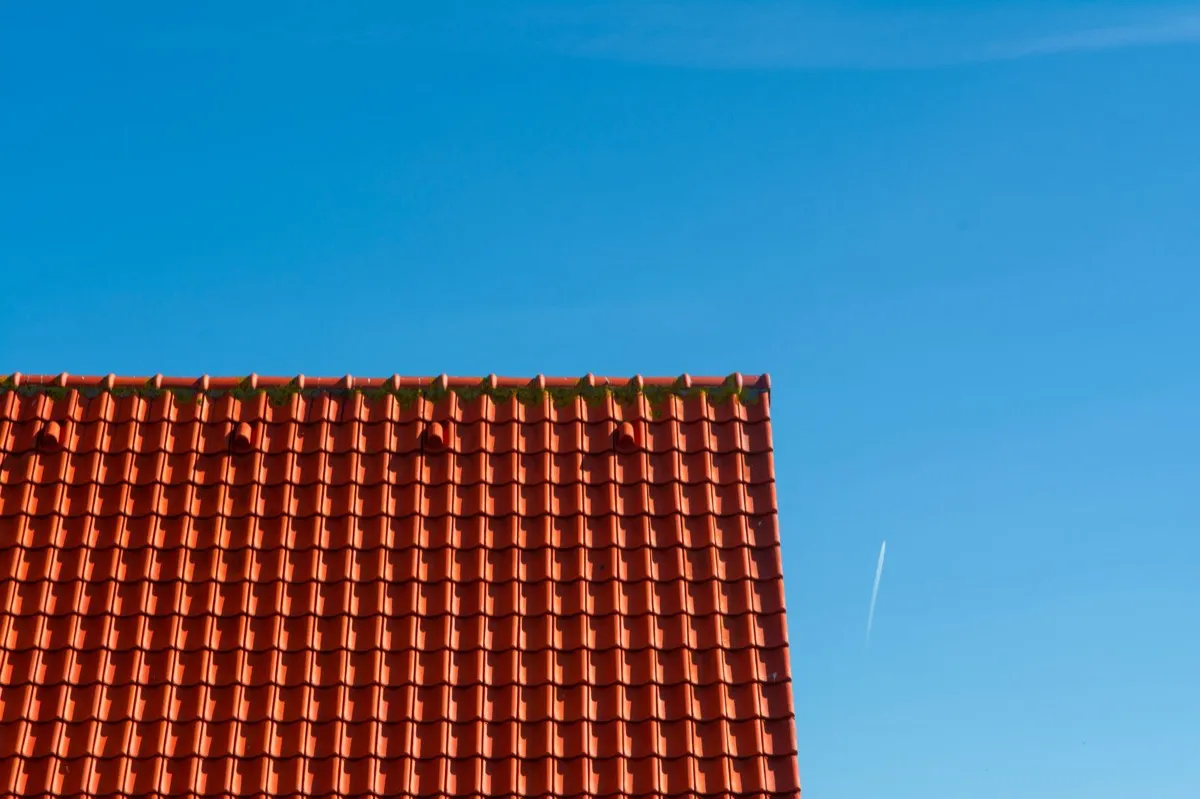 Tile roof gable in full sun, the kind of exposure that sets roof life in Aloha, OR